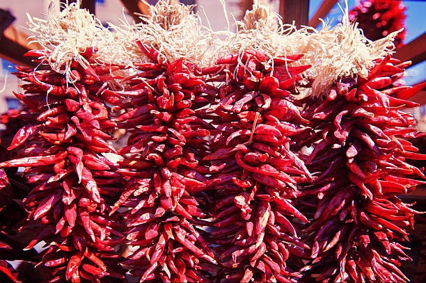 istock Santa Fe Hot Red Chili Peppers Ristras Hanging 597940352