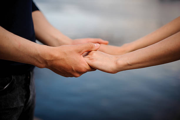 istock Happy couple holding hands together 597941390