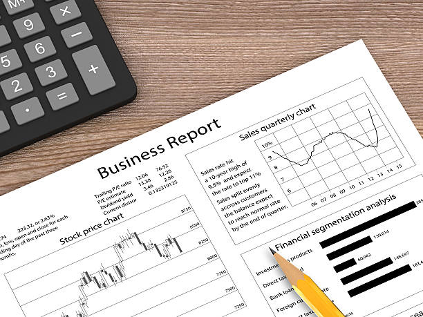 istock Business plan report wooden desk top view 597941732