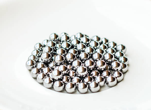 istock bearings in a dish on wooden table 597942092