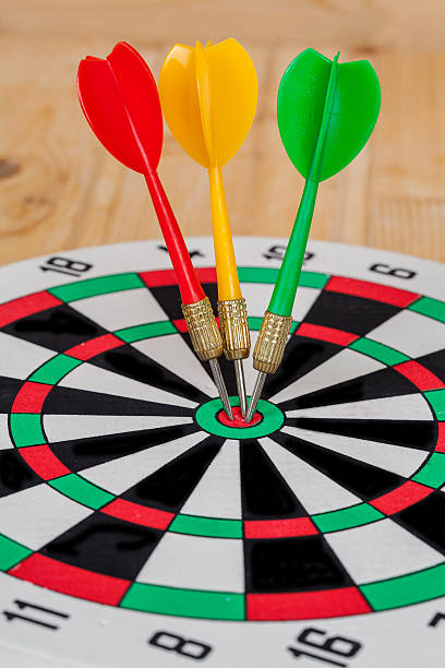 istock Dart arrow hitting in bullseye on dartboard 597943512