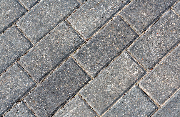 istock Close-up of grey pavement cobble stones. 597944142