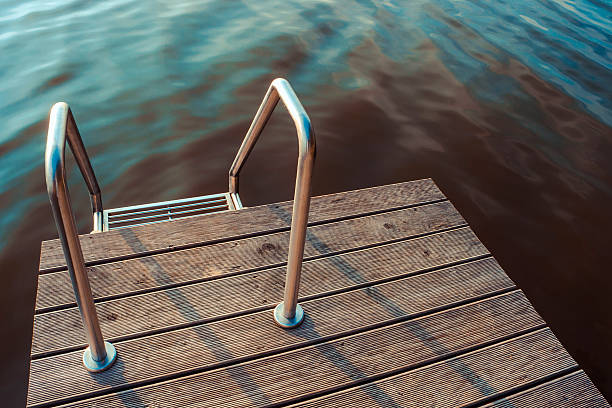 istock Metal ladder in pool 597944440