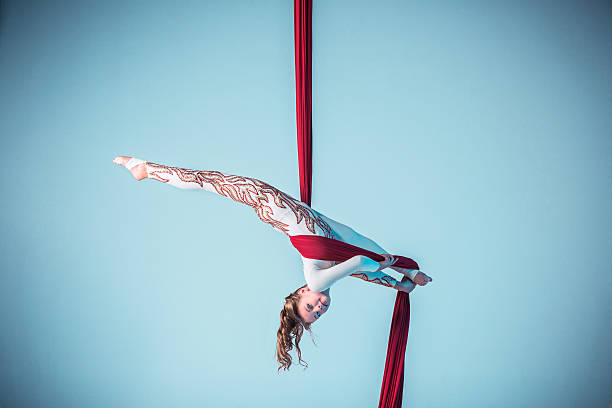 istock Graceful gymnast performing aerial exercise 597950518