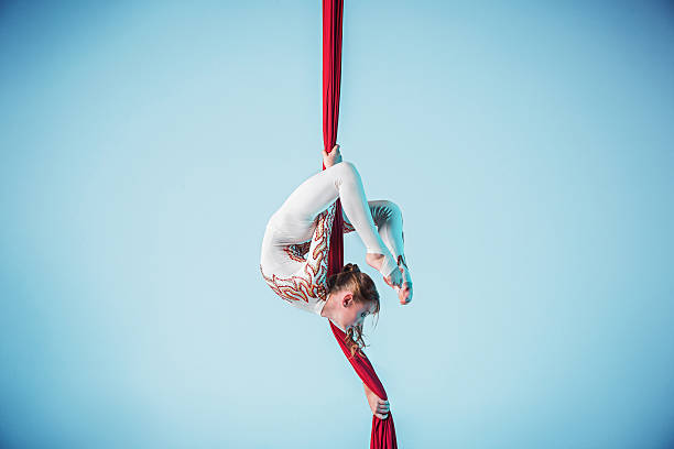 istock Graceful gymnast performing aerial exercise 597950690