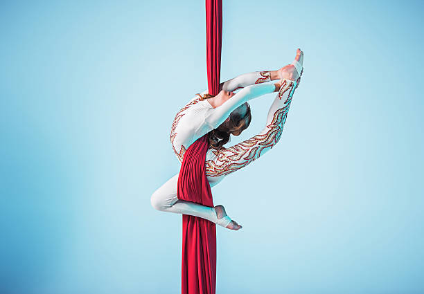 istock Graceful gymnast performing aerial exercise 597951132