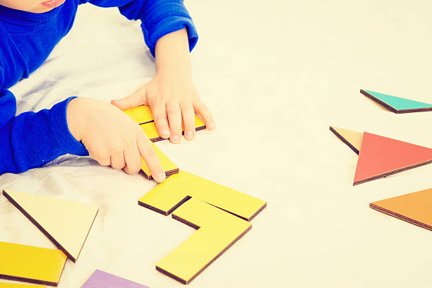 istock early education -little boy playing with puzzle 597951266
