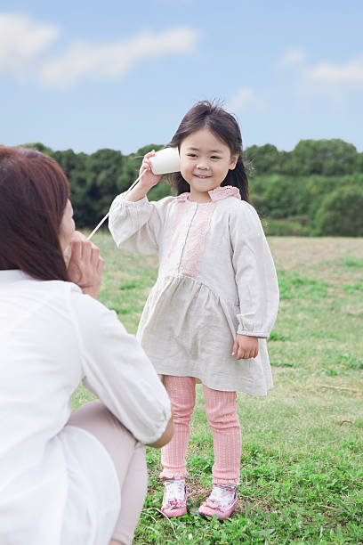 istock Japanese mother and daughter playing outside 597953382