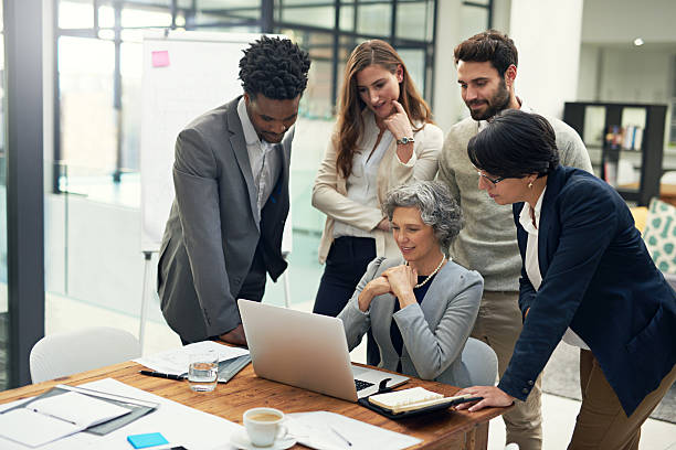 istock Putting their heads together 597953722