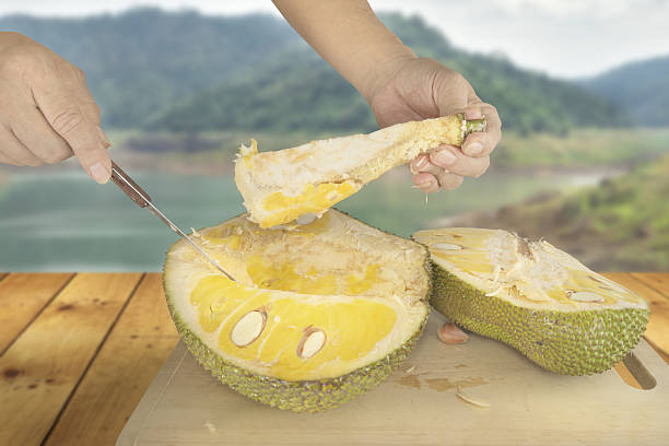 istock Removing inedible core out of Jackfruit 597954594