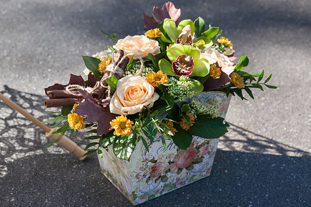 Beautiful bouquet with roses, cinnamon and orchids