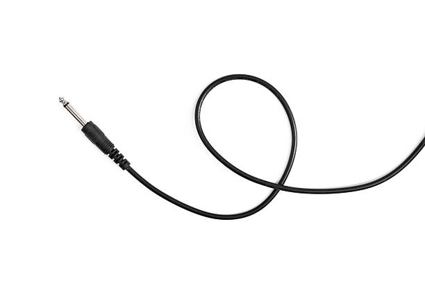 istock Guitar audio jack with black cable isolated on white background 597955722