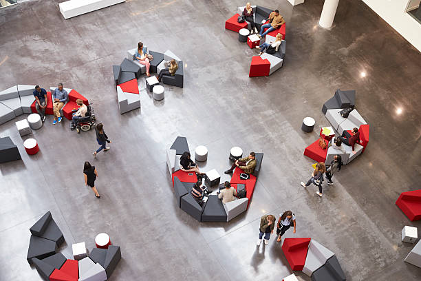 istock Students in the atrium of modern university, elevated view 597957806