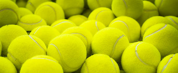 Lots of vibrant tennis balls stock photo