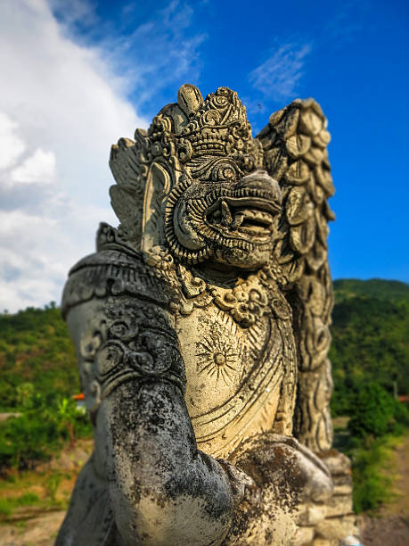istock Stone Carved Traditional Warrior Statue Head Indonesia 597958414