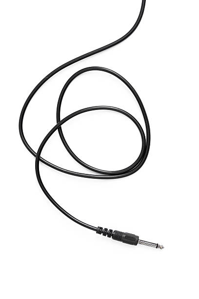 istock Guitar audio jack with black cable isolated on white background 597959652