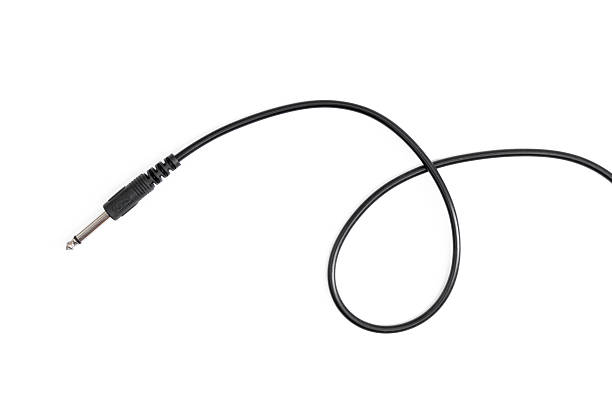 istock Guitar audio jack with black cable isolated on white background 597959854