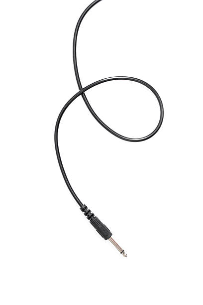 istock Guitar audio jack with black cable isolated on white background 597959878