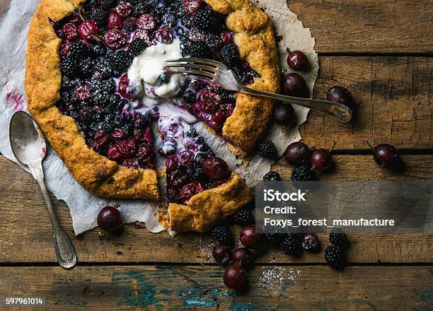 Garden Berry Crostata Sweet Pie With Melted Vanilla Icecream Stock Photo - Download Image Now