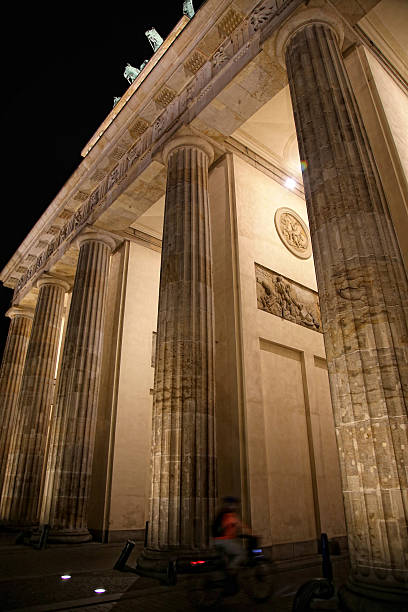 istock Brandenburg gate at night in Berlin, Germany 597962690