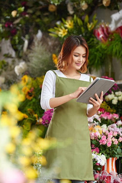 istock Working in flower shop 597964956