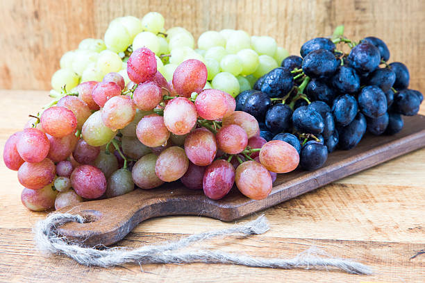 istock Grapes on a wooden table 597966390