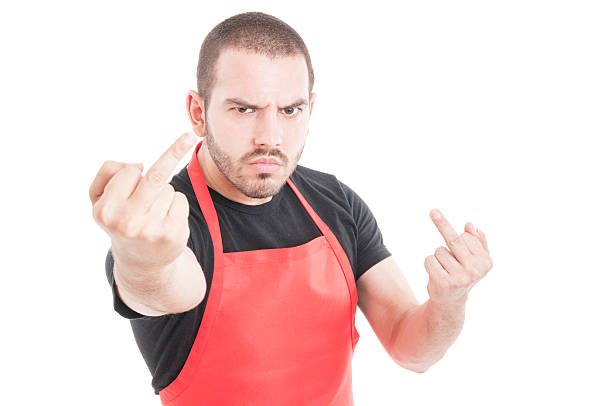 istock Aggressive supermarket employee doing double obscene sign 597968060