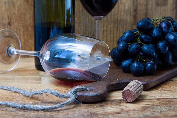 istock Fresh grape and red wine on the vintage table 597968894