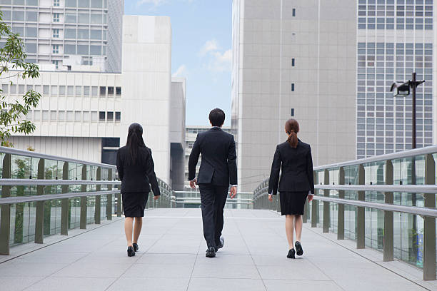 istock Japanese employees walking outside 597969518