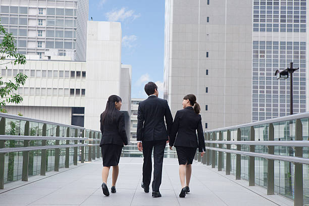 istock Japanese employees walking outside 597969616