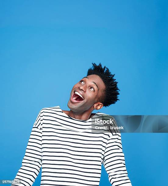 Excited Afro American Guy Stock Photo - Download Image Now - People, Happiness, Looking Up