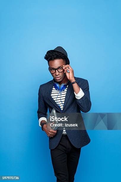 Afro American Guy In Fashionable Outfit Holding Notebook Stock Photo - Download Image Now