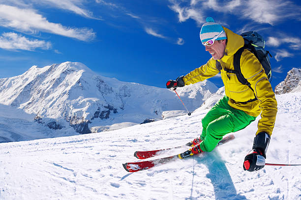 istock Skier skiing downhill against Matterhorn peak in Switzerland 597971722