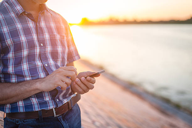 istock Businessman looking at smartphone 597972090