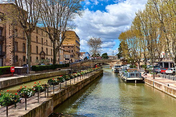 The Canal de la Robine in Narbonne city The Canal de la Robine in Narbonne city.  Languedoc-Roussillon, France narbonne stock pictures, royalty-free photos & images