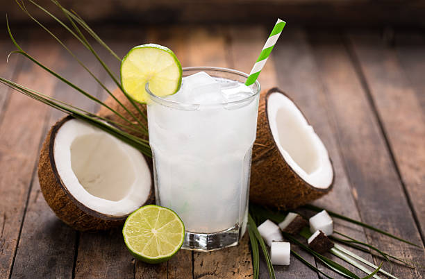Coconut water Coconut water  coconut milk photos stock pictures, royalty-free photos & images
