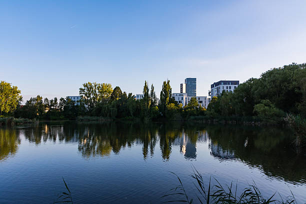 istock Blue Sky Lake Reflection Landscape European Modern Architecture 598054866
