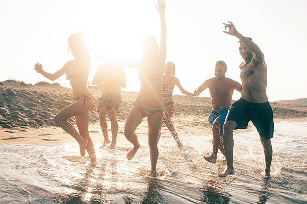 istock Young people having fun in the sea 598055174