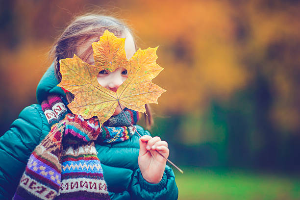 istock Little girl in autumn park 598057152