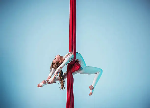 Photo of Graceful gymnast performing aerial exercise