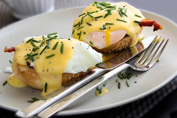 istock Eggs Benedict dish consisting of poached eggs and sliced ham 598059176