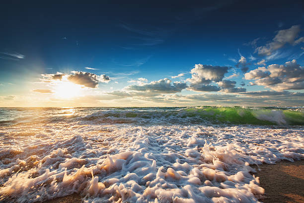 istock Sunrise with beautiful cloudscape over the sea 598061766