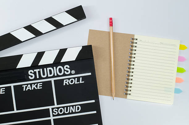 istock Slate film and notebook white background 598062178