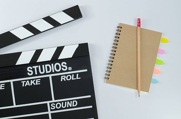 istock Slate film and notebook white background 598062236