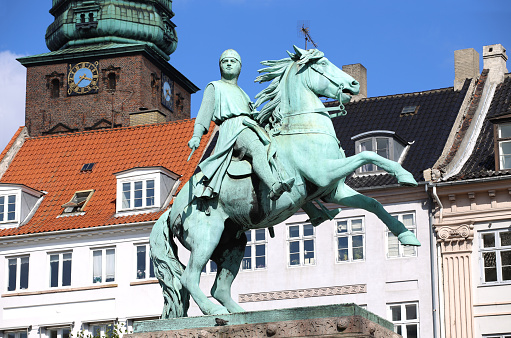 Mozart statue in Salzburg, Austria on a bright spring morning.  In the background are construction storage containers.