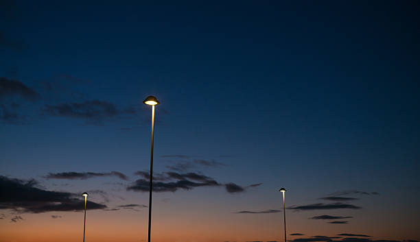 istock Street lamps and dusk horizon 598062542