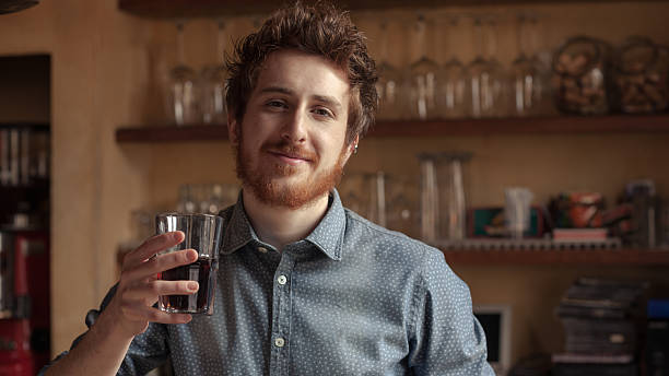 istock Hipster man drinking a glass of coke 598062596