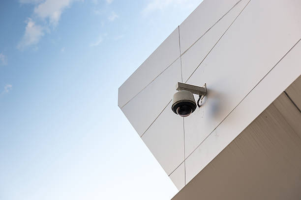 cctv on the wall of building stock photo