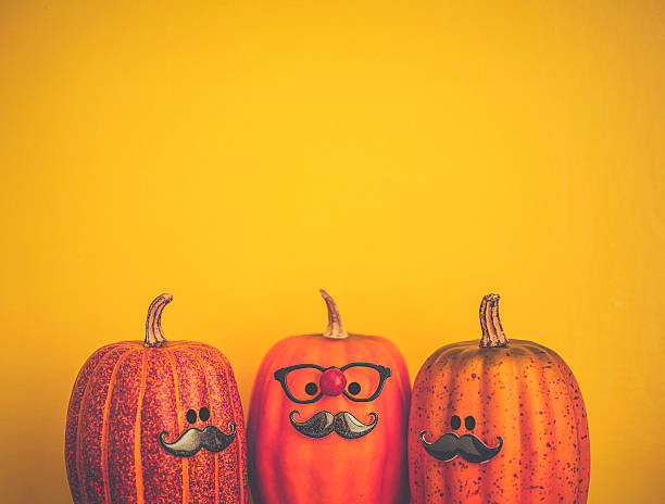 trois personnages de citrouille portant des moustaches pour halloween - gourd halloween fall holidays and celebrations photos et images de collection