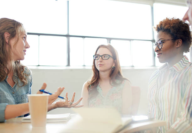 istock Unposed group of adult student in an open concept  class 598064990